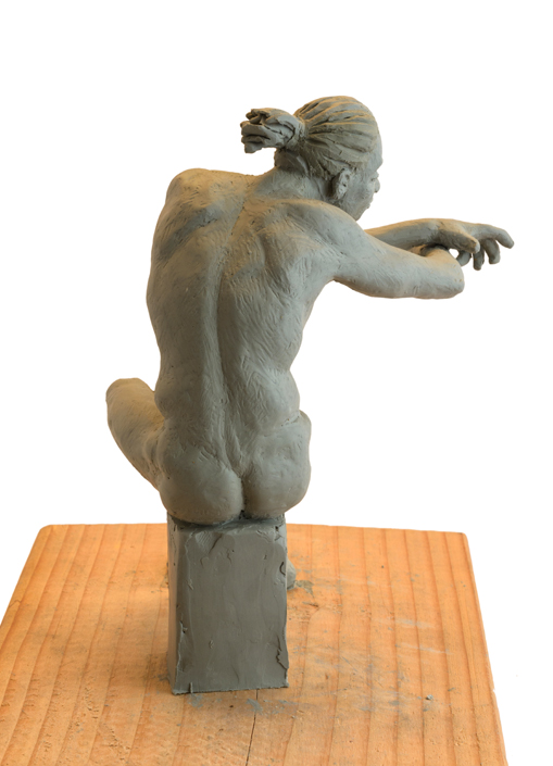 Seated Man Clay Sculpture
