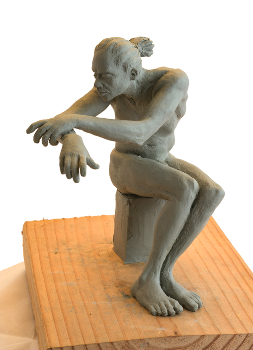 Seated Man Clay Sculpture