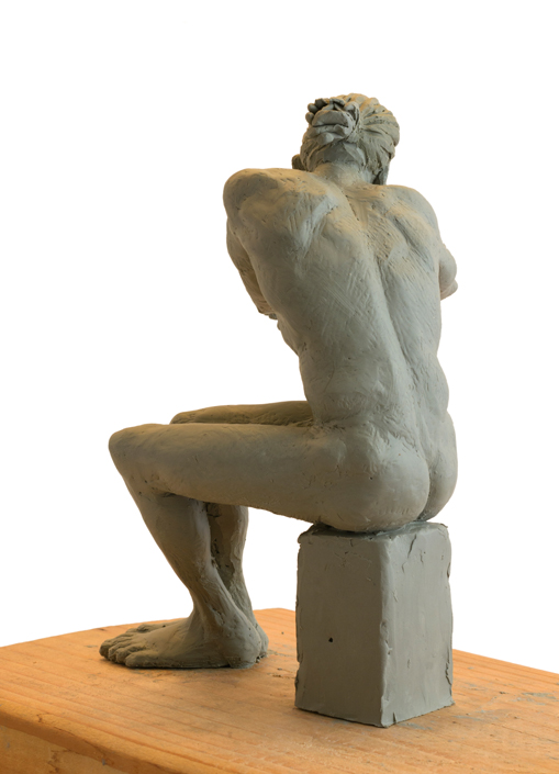 Seated Man Clay Sculpture