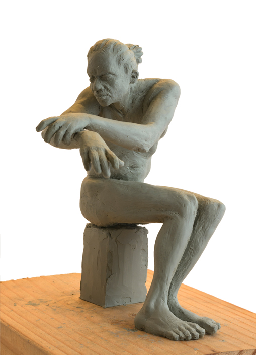 Seated Man Clay Sculpture